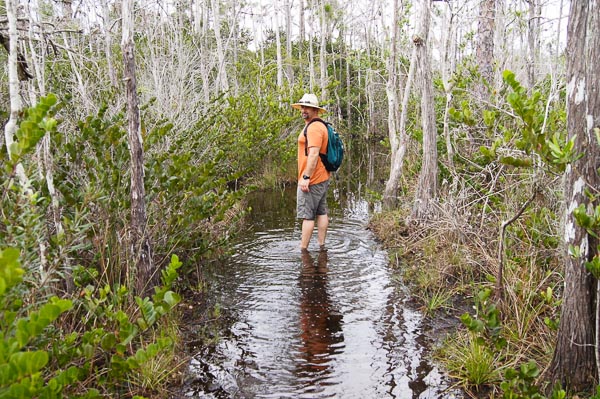 Scott walking in a creek